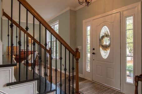 Real Estate - Brown Wooden Staircase With Brass Chandelier