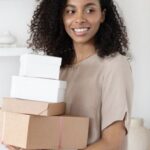 Successful Home Selling Tips - A Woman Holding Cardboard Boxes