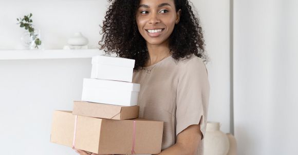 Successful Home Selling Tips - A Woman Holding Cardboard Boxes