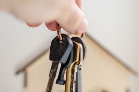 Property Investment - Person with keys for real estate